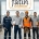 Four factory workers stand together in a workshop under a Fatih logo banner, one in a safety vest holding a helmet and a clipboard, others with boxes and tools nearby.