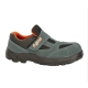 Blue-gray children's shoe with a Velcro strap, black rugged sole, and orange interior lining. -